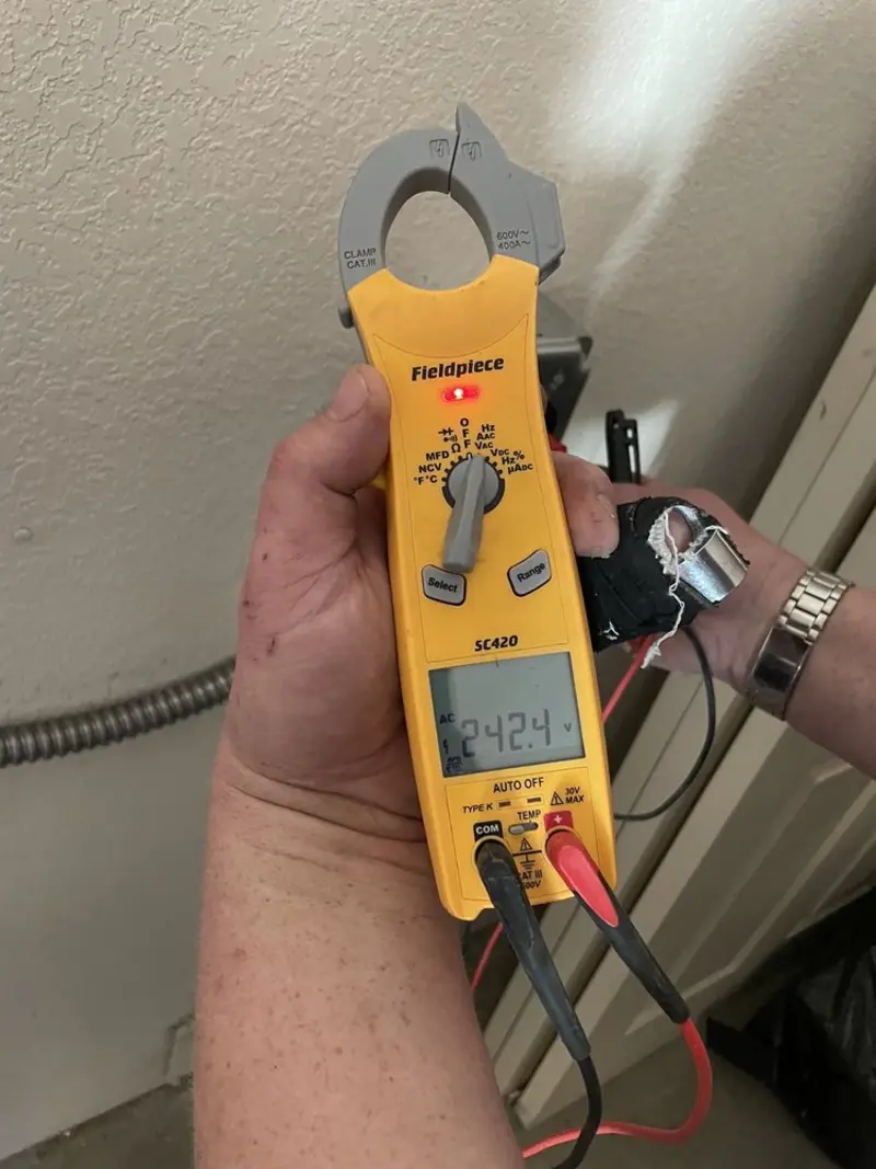 Voltage testing with clamp meter during Outlet Installation in Guadalupe